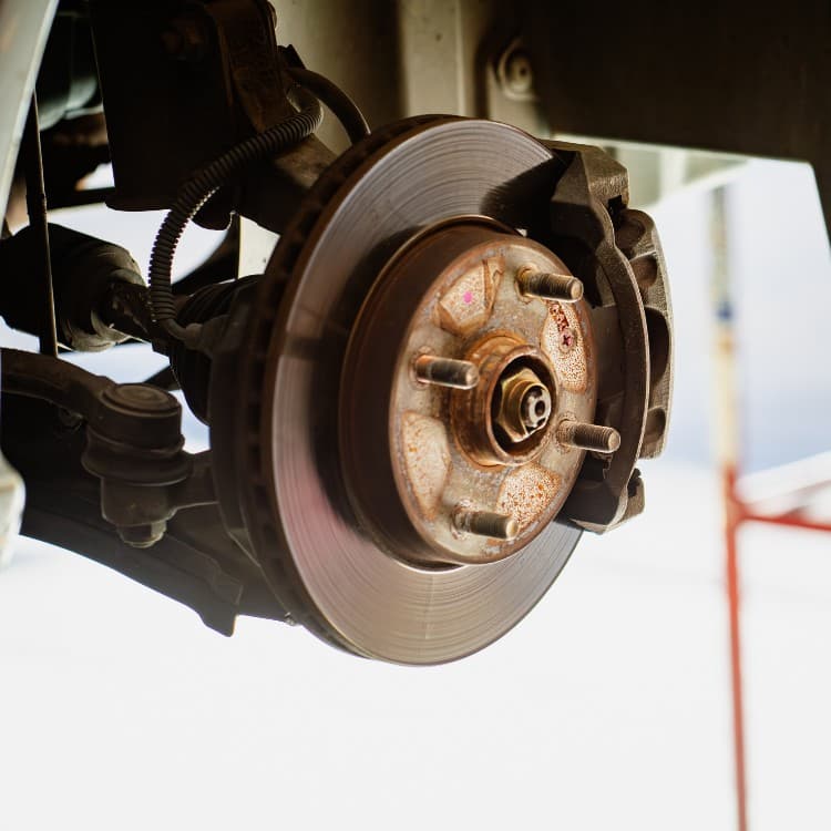 Brake rotor and caliper with the wheel removed