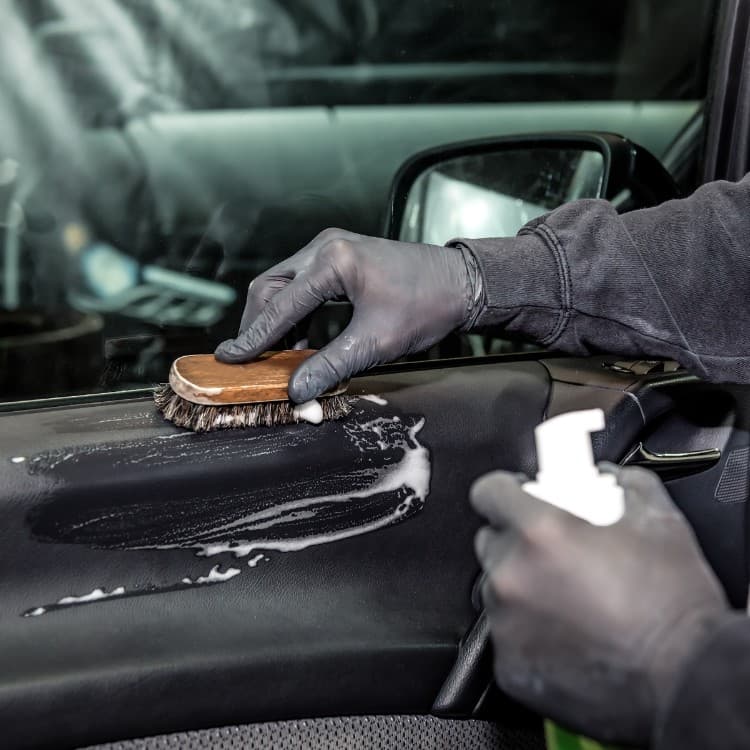 Interior door panel scrubbed with a detailing brush